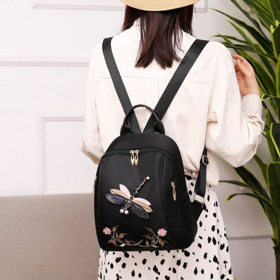 Charming Dragonfly Floral Black Woman Backpack